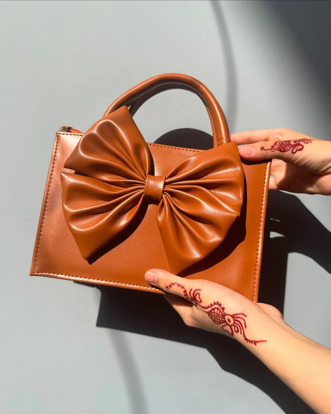 SIGNATURE BOW BAG